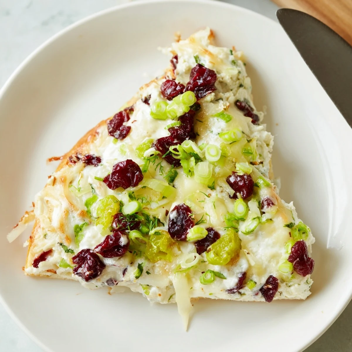 Creamy Cranberry Jalapeño Dip Pizza topped with melted cheese and fresh ingredients.  