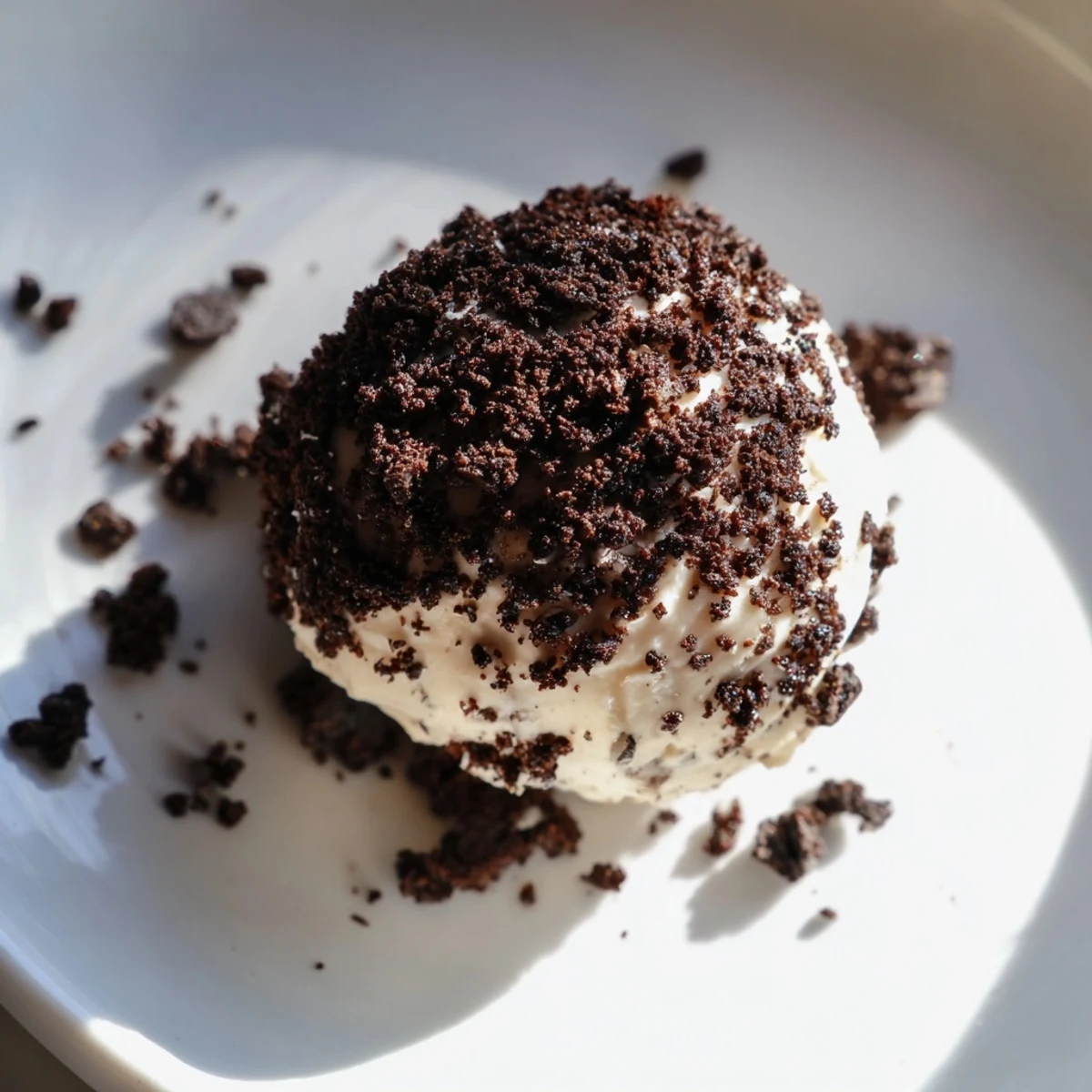 Delicious Cream Cheese Oreo Protein Balls: a close-up of the rolled, coated protein balls ready to chill.