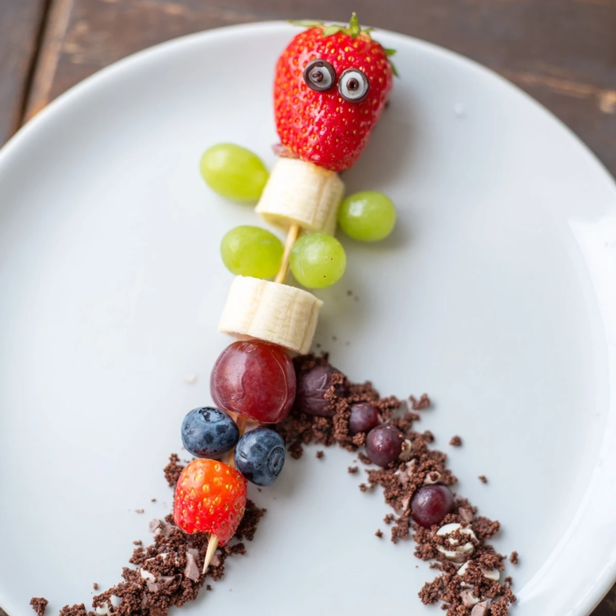 Vibrant Caterpillar Fruit Skewer Track, a colorful and playful healthy snack for kids' parties.