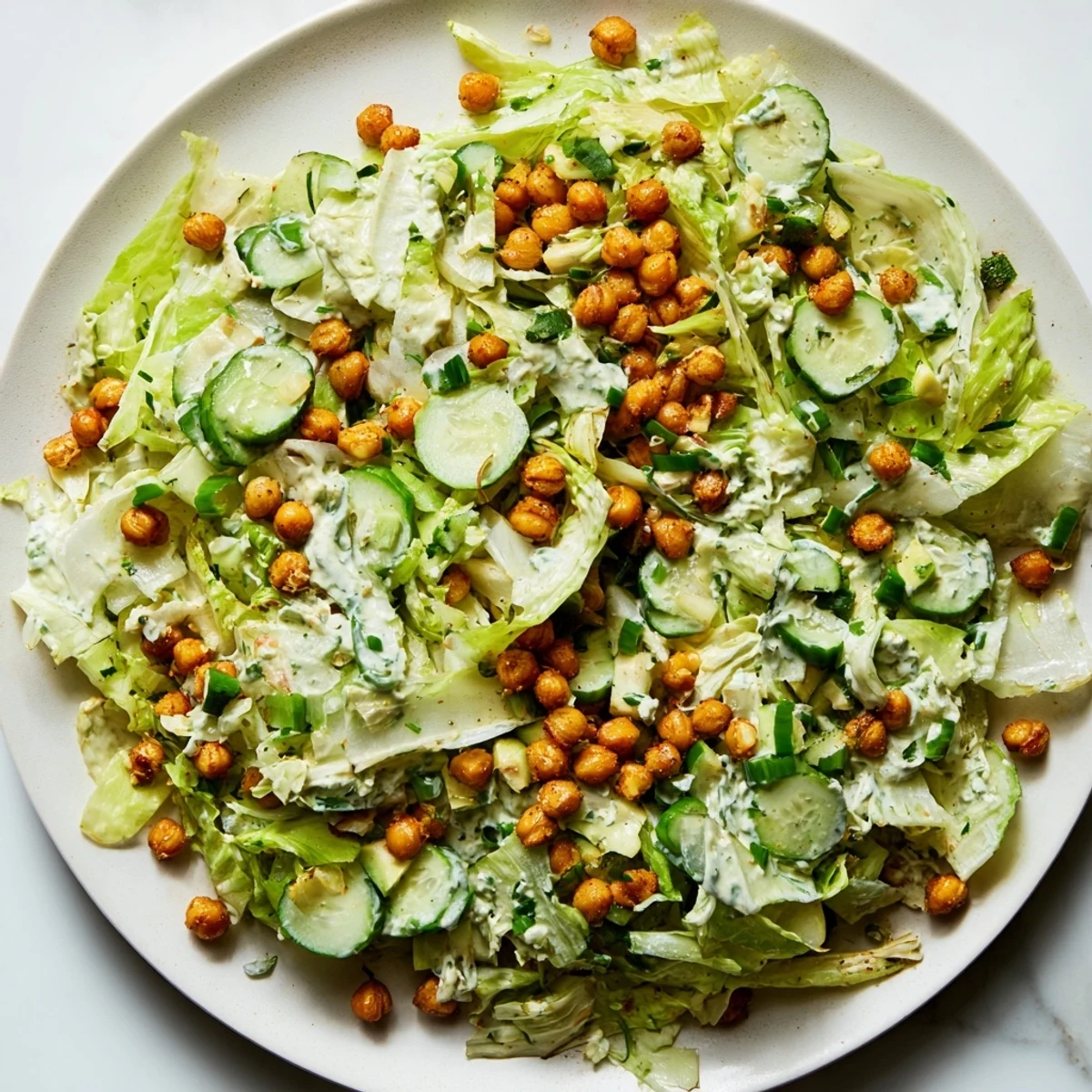 Fresh Green Goddess Salad with crispy golden chickpeas, a healthy and delightful vegetarian meal.