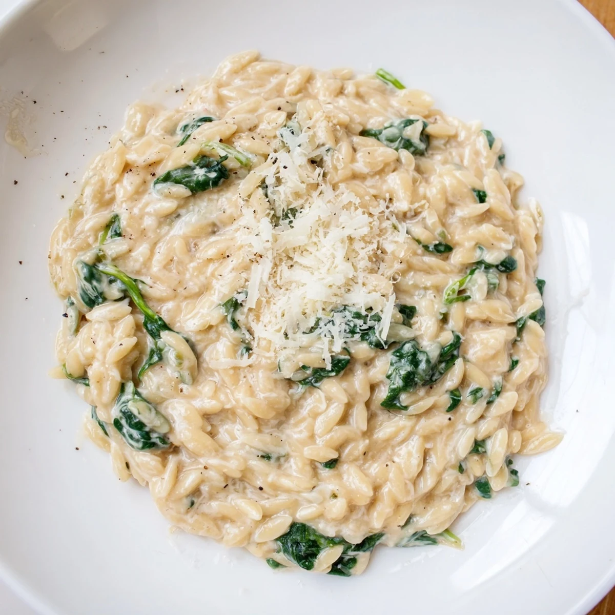 Steaming Creamy Spinach Orzo, a one-pan wonder, is rich, cheesy, and bursting with fresh spinach goodness.