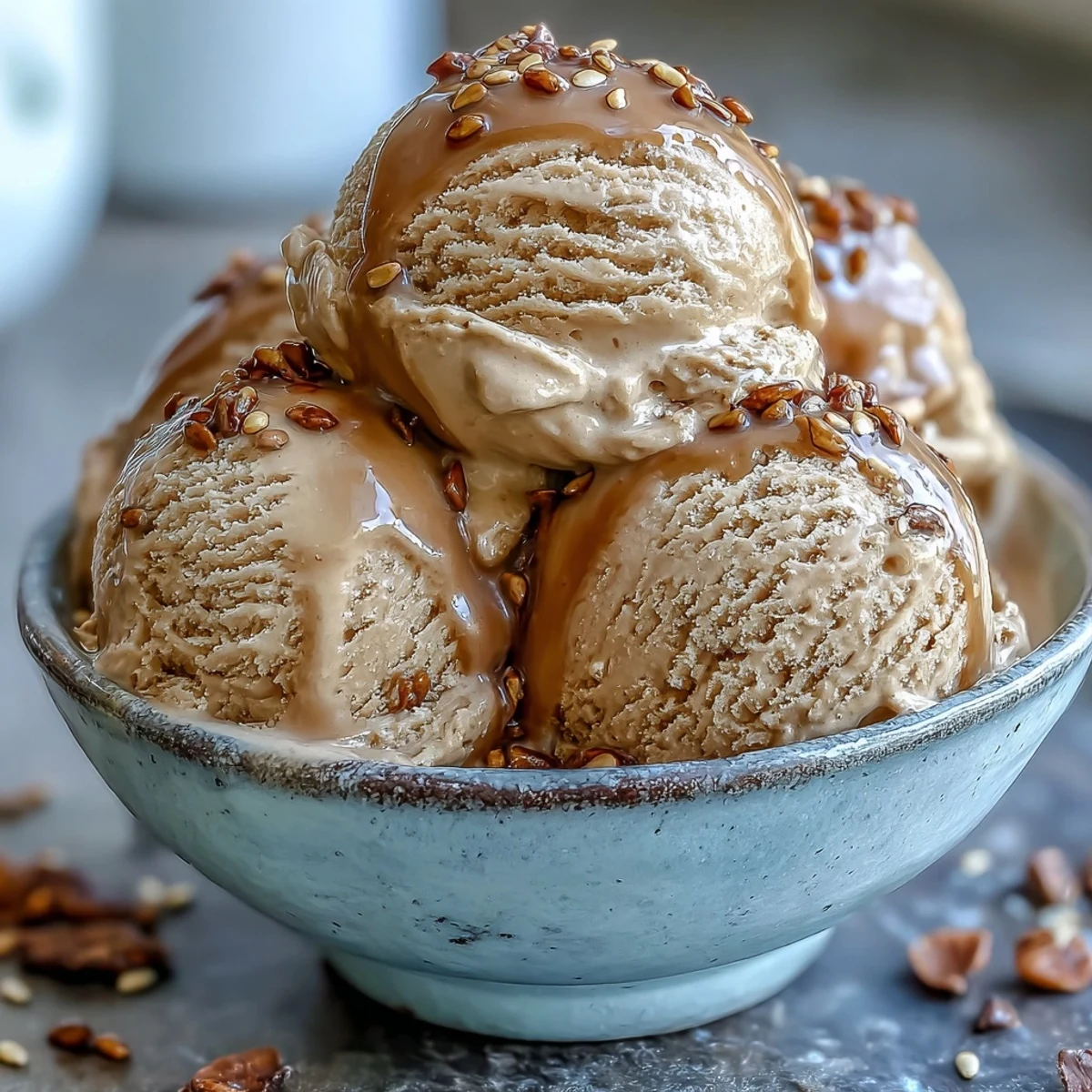 Homemade Hojicha Ice Cream in a waffle cone, showcasing its rich roasted green tea caramel hue.