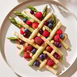 Freshly prepared The Botanical Lattice, showcasing a delicate asparagus weave filled with juicy, colorful berries.