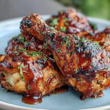Sweet and tangy BBQ chicken drumsticks, brushed with sticky peach glaze.