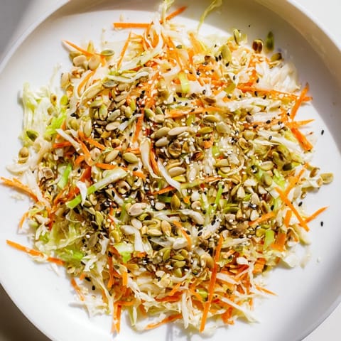 Appetizing Cabbage-Core Slaw Salad, featuring finely shredded cabbage cores with a rich sesame dressing, ready to enjoy.