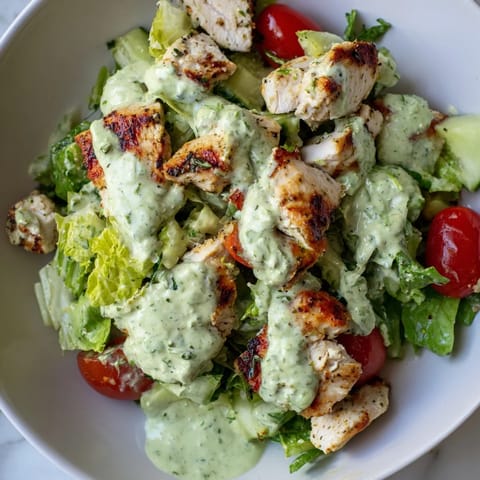 Fresh Avocado Ranch Chicken Salad with cherry tomatoes, cucumber, and herbs, served chilled as a refreshing gluten-free main dish.