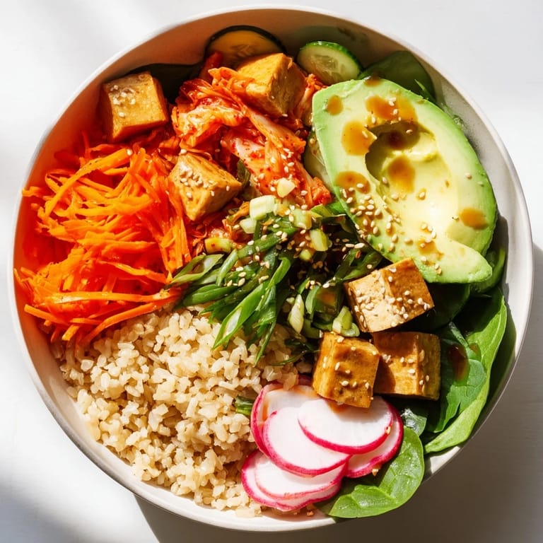 Delicious fermented vegetable bowl topped with avocado, crunchy radishes, and tangy dressing.  