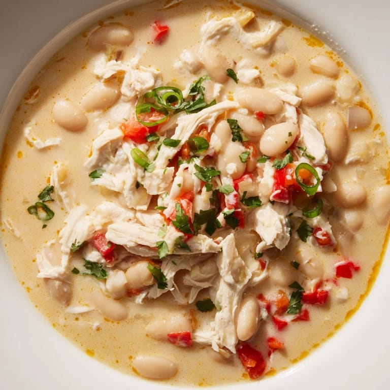 Delicious Creamy White Chicken Chili with beans, perfect for a cozy, flavorful and easy weeknight dinner.