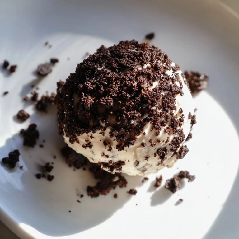 Delicious Cream Cheese Oreo Protein Balls: a close-up of the rolled, coated protein balls ready to chill.