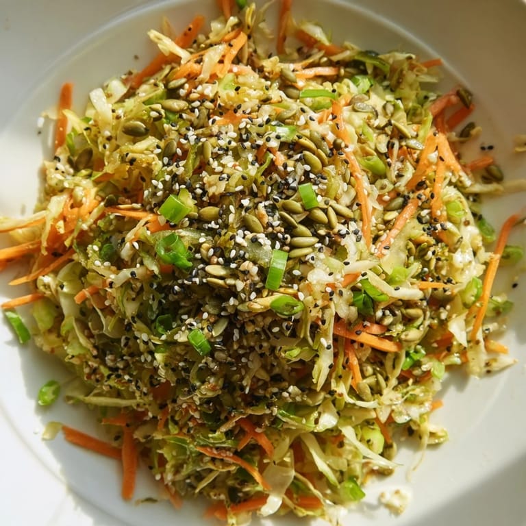Close-up of fresh Cabbage-Core Slaw Salad, showcasing colorful textures and a delicious, Asian-inspired flavor profile.